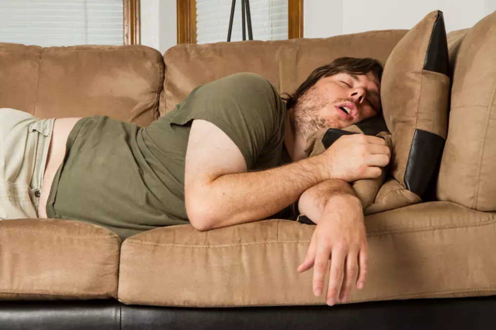 fat guy passed out hard on the couch